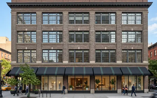 Brick commercial building in Manhattan with ground-floor plate-glass windows