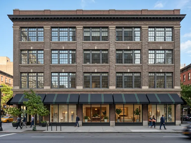 Brick commercial building in Manhattan with ground-floor plate-glass windows